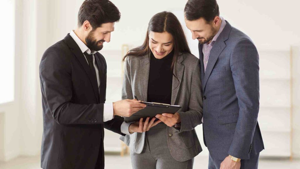 Property professionals reviewing documents related to real estate and property law in Dubai