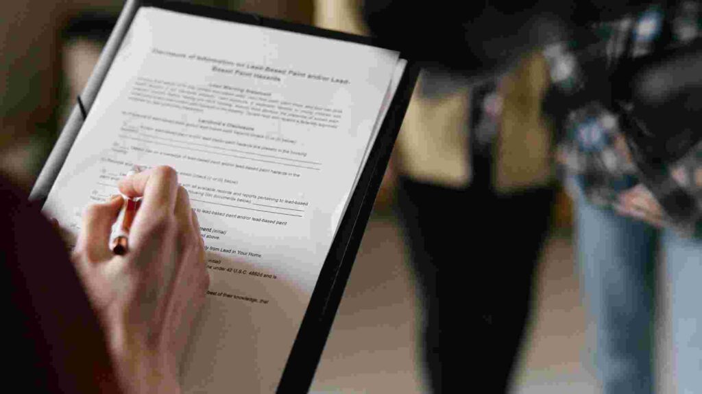 Signing property contract paperwork in compliance with Dubai real estate laws and regulations.