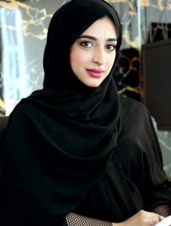 A professional Emirati woman in traditional attire holding a document, exuding confidence and poise.